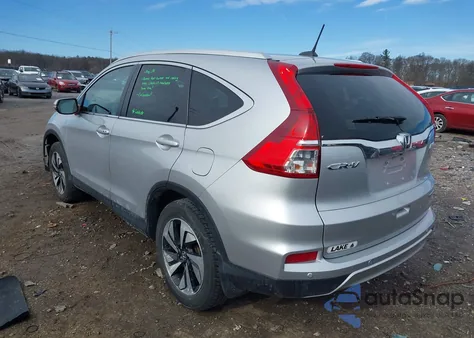 2016 Honda Cr-V Touring z USA, uszkodzony, nr VIN 5J6RM4H96GL119261